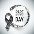 Symbol of rare disease awareness day, ribbon with zebra-print.