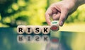Symbol for reducing a risk. Cubes form the word `risk` Royalty Free Stock Photo