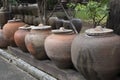 symbol of several jars with wooden lids on top