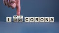 Symbol for a succesful corona treatment. Hand turns cubes and changes the expression `I have corona` to `I had corona`. Beauti