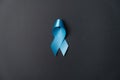 Symbol for support men. Blue ribbon on grey background. Prostate Cancer Awareness, Movember Men`s health awareness. Healthcare