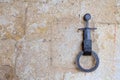 Symbol of the Sword in the stone on the knocker at the entrance of the chapel of the knight Galgano founder of the eponymous abbey