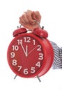 Symbol of time : hand holding red clock , eleventh hour isolated