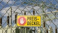 German info sign Preisdeckel price cap with transformer station in background