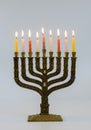 A symbolic candle lighting for the Jewish holiday of Hanukkah Menorah with lit candles in celebration of Chanukah