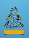 A symbolic Christmas tree made of construction tools on a blue background.