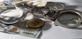 Symbolic coins of bitcoin and stack of bitcoin coins and metall handcuffs on banknotes of one hundred dollars. Exchange