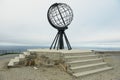 The symbolic globe at the North Cape point in a cloudy weather day in North Cape, Norway. Royalty Free Stock Photo