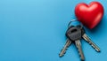 Symbolic homeownership keys, heart keyring, copy space for real estate love ownership concept Royalty Free Stock Photo