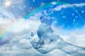 Symbolic image dog angel sitting on a protective hand in heaven Royalty Free Stock Photo