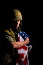 Symbolic image of Vietnam War veteran soldier holding the American flag. Royalty Free Stock Photo