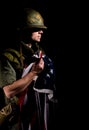 Symbolic image of Vietnam War veteran soldier holding the American flag. Royalty Free Stock Photo