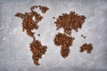 Symbolic image of world map made from roasted coffee beans