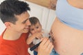 Symbolic labour counting with black marker strikes. Smiling proud adult caucasian father and his first-born son