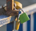 Symbolic love padlocks fixed to the railings of bridge