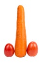 Symbolic phallic concept image of carrot and two tomatoes Royalty Free Stock Photo