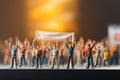 Symbolic resistance miniature people holding signs, hands raised for revolution