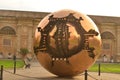 Symbolic statue in vatican city of a large sphere