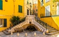 Stone stairs and fountain at Rue du Poilu street and Place du Conseil square in old town of Villefranche-sur-Mer resort in France