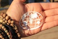 Symbolic world map in the hands of hippie girl