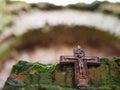 Symbolism. A small Christian crucifix on the ruins of the Church Royalty Free Stock Photo