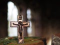 Symbolism. A small Christian crucifix on the ruins of the Church Royalty Free Stock Photo