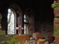 Symbolism. A small Christian crucifix on the ruins of the Church Royalty Free Stock Photo