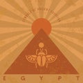 Symbols of ancient Egypt in an old style. Scarab beetle, pyramid and sun.