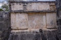 Symbols on an ancient Maya monument in the city of Chichen Itza in Piste - Mexico