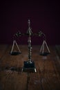 Symbols of law and justice. Themis. Dark rustic background Royalty Free Stock Photo