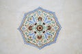 symetrical floral ornament on a ceiling in Amber Palace in Jaipur, Rajasthan, India