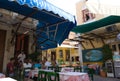 Smaal, old fashioned restuarant at lunchtime on the charming Greek island of Symi Royalty Free Stock Photo