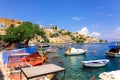 Panoramic view, aerial skyline of small haven of Symi island. Village with tiny beach and colorful houses located on