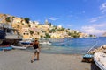 Panoramic view, aerial skyline of small haven of Symi island. Village with tiny beach and colorful houses located on