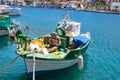 SYMI, Greece - 03 JUNE 2021. A traditional Greek fishing boat in the Gialos harbour district on the island of SYMI. The fisherman