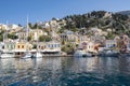 Symi Main Port with Boats and Yachts and Colorful Houses Royalty Free Stock Photo