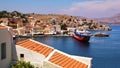 Symi town, Symi island, pictorial view of colorful houses and Yialos harbour