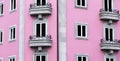 Symmetric Windows from a Pink building in Braga.