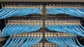 Symmetrical Array of Blue Network Cables Connected to a Data Center Switch with Active LED Lights Royalty Free Stock Photo