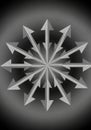 A symmetrical design with metallic silver arrows radiating from a central point, forming a Royalty Free Stock Photo