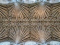 The symmetrical detail of the vaulted ceiling and ornate bosses in Norwich Cathedral, Norfolk, UK