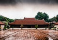 Symmetrical front view of the Chinese Temple of literature on a rainy day with dramatic sky and no people. Hanoi, Vietnam - 04/02