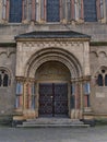Symmetrical front view of ornamented entrance of historic church Herz-Jesu-Kirche built in Neo-Romanesque style in 1903. Royalty Free Stock Photo