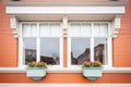 symmetrical georgian windows with dentil decoration above Royalty Free Stock Photo