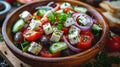 Symmetrical greek salad with fresh ingredients and olive oil dressing on wooden table Royalty Free Stock Photo