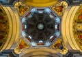 Symmetrical interior shot of masterful ceiling of Salzburg cathedral in Austria Royalty Free Stock Photo