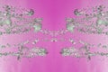 Symmetrical pattern of stopped water droplets with transparent streams on a pink background. Clash, opposition and mystical