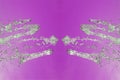 Symmetrical pattern of stopped water droplets with transparent streams on a purple background. Clash, opposition and mystical Royalty Free Stock Photo