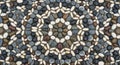 Symmetrical pebble mosaic pattern composed of variously colored stones, including white, black, Royalty Free Stock Photo
