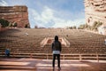 Symmetrical Portrait of Male Person Standing Front and Center on a Stage Dreaming and Imagining the Future while Facing Stadium St